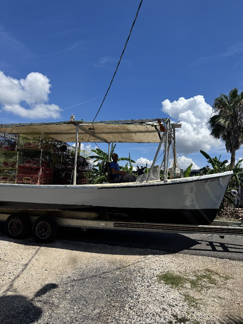A Louisiana crab boat loaded with traps on its trailer